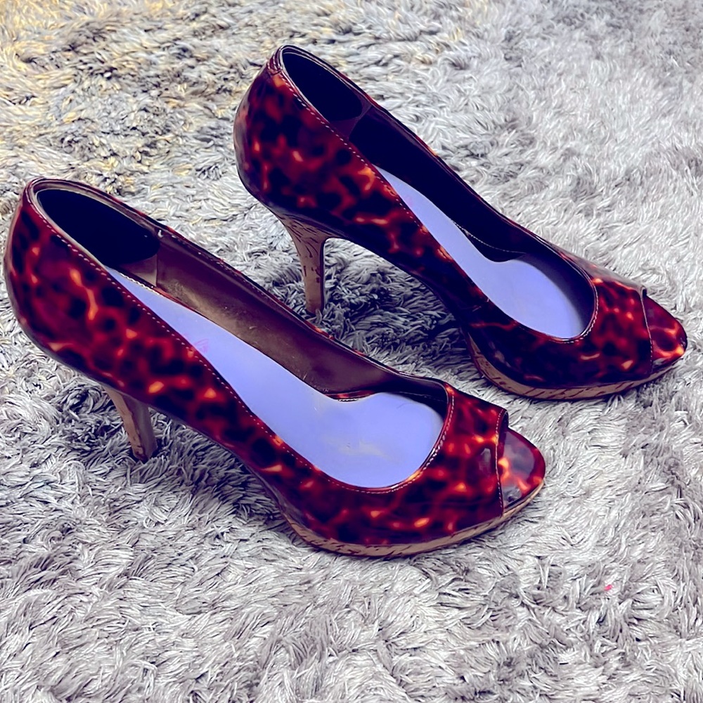 Size 8 Nine West leopard patent leather open toed, cork accented high heels.